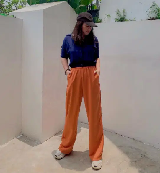 Orange pants with dark blue shirt