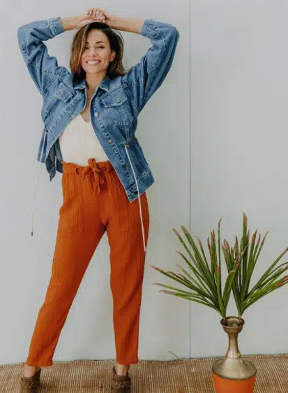 Orange pegged pants with denim jacket